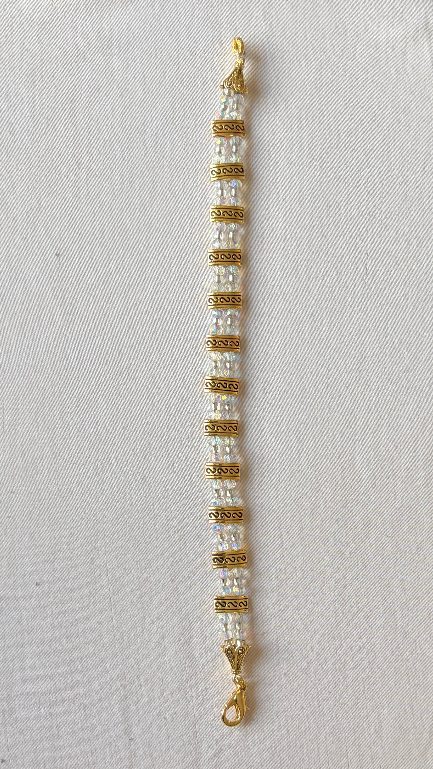 Iridescent crystal and antique gold spacer bracelet with lobster claw clasp