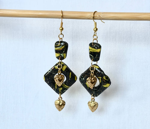 Black and yellow marbled polymer clay two-tier drop earrings with gold sacred heart charms