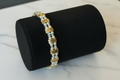 Iridescent Crystal Boho Bracelet on matte black leather stand